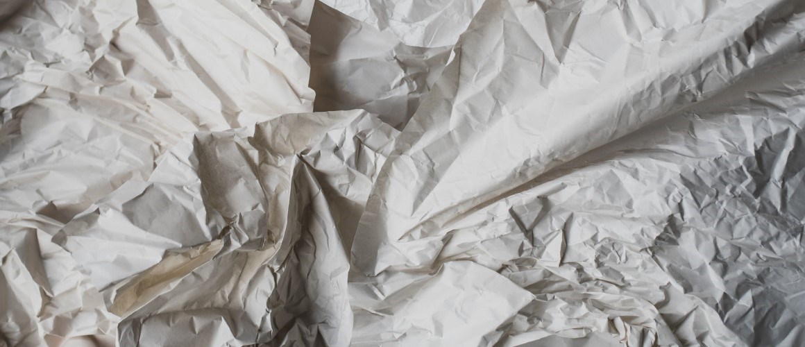 Crumpled white paper.