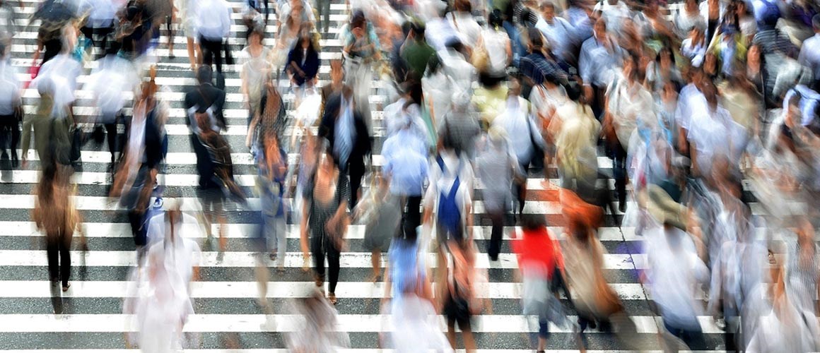 Blurry image of pedestrians crossing the road